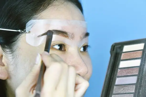 Use a brow stencil